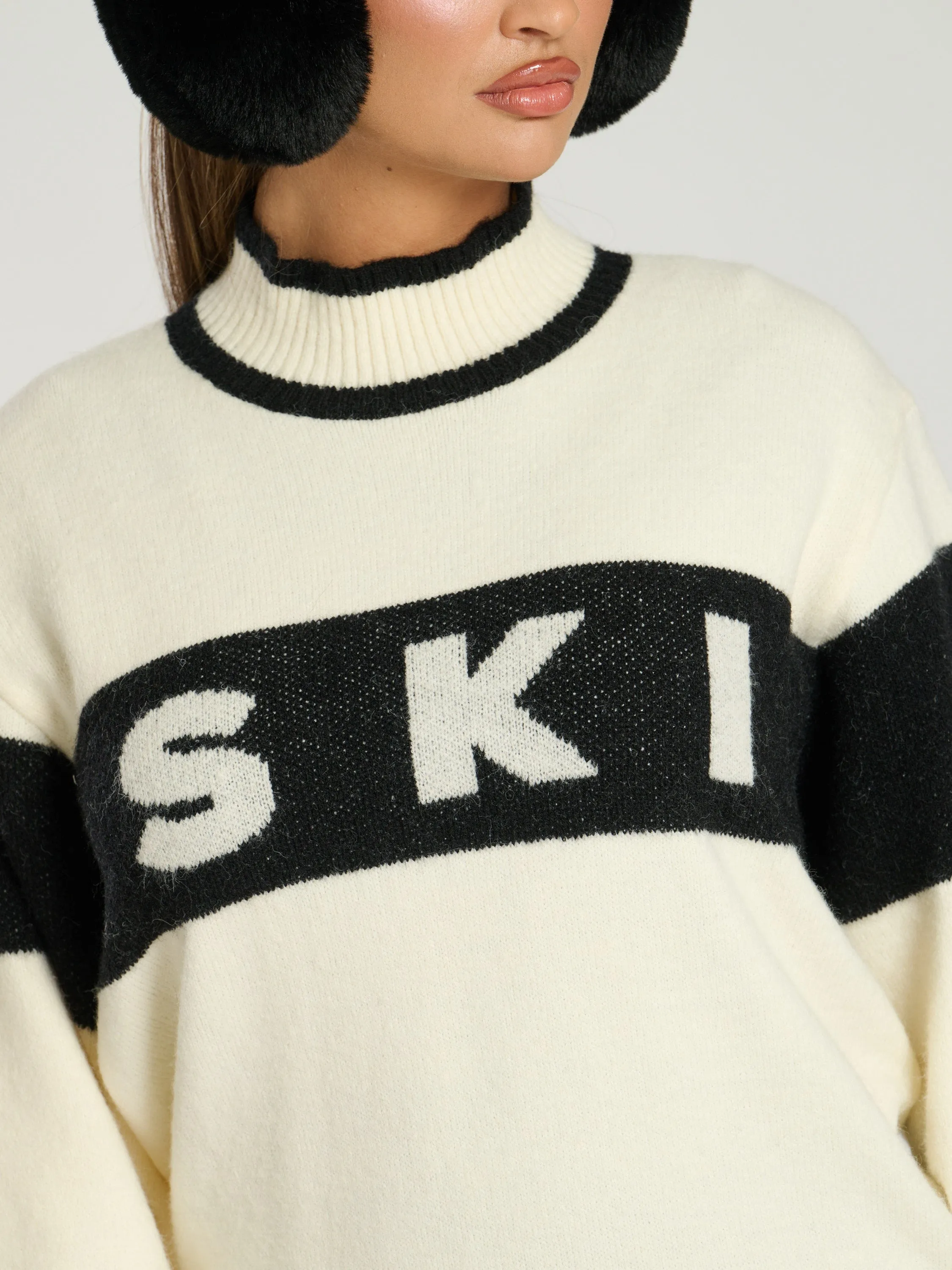 The 'Marshmallow' black ski slogan knitted jumper